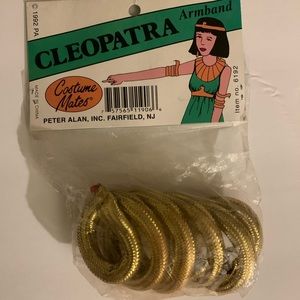 This is a gold cleopatra armband.